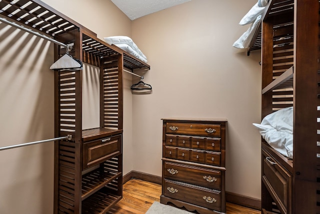 spacious closet featuring light hardwood / wood-style floors