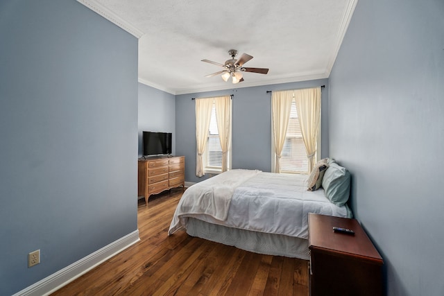 bedroom featuring ornamental molding, hardwood / wood-style floors, and ceiling fan