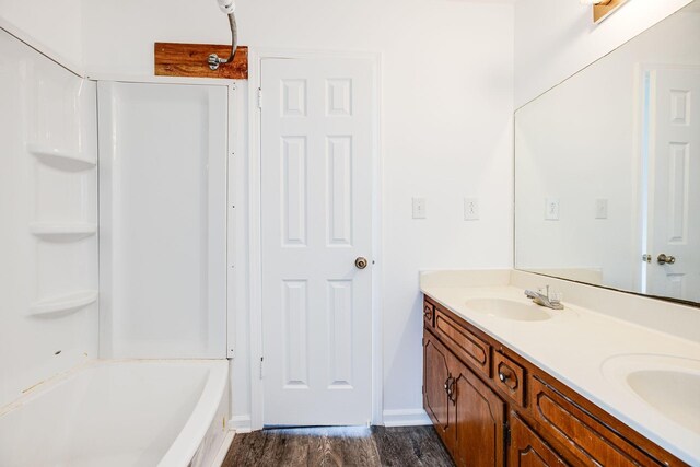 bathroom featuring vanity and wood-type flooring