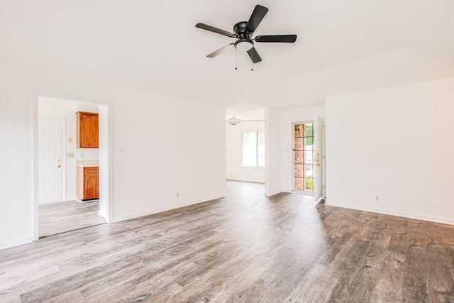 unfurnished room with light wood-style flooring and baseboards