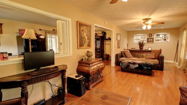 bedroom with light wood-type flooring and ceiling fan