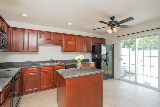 kitchen with ceiling fan, black appliances, light tile patterned floors, a center island, and sink