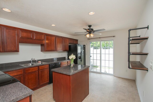 kitchen with black appliances, light tile patterned floors, ceiling fan, sink, and a kitchen island