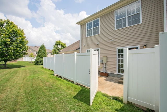 rear view of house with a yard