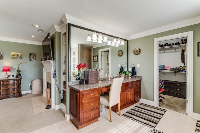 bathroom featuring vanity, tile patterned flooring, and crown molding