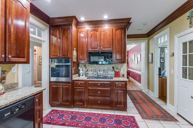 kitchen with light tile patterned flooring, black appliances, crown molding, light stone countertops, and backsplash