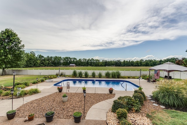 view of swimming pool featuring a gazebo