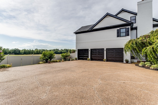 view of side of property featuring a garage