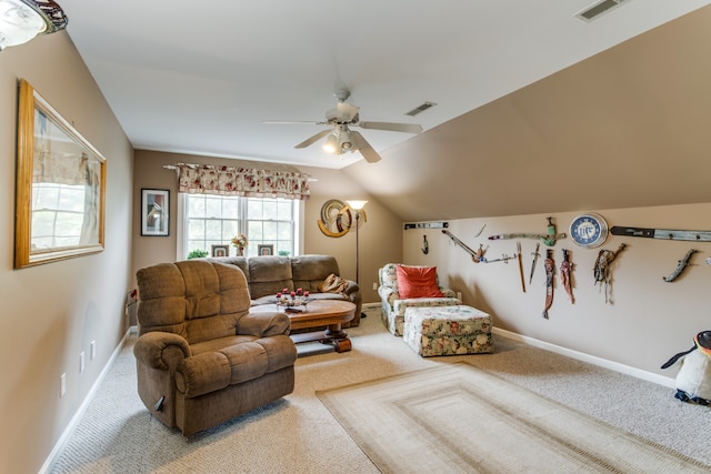 living area with carpet flooring, lofted ceiling, and ceiling fan