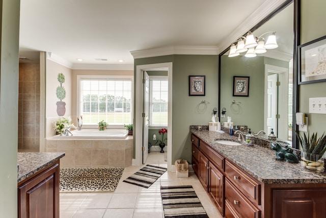 bathroom featuring tile patterned flooring, crown molding, vanity, and a relaxing tiled tub