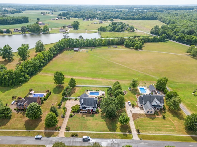 birds eye view of property with a rural view and a water view