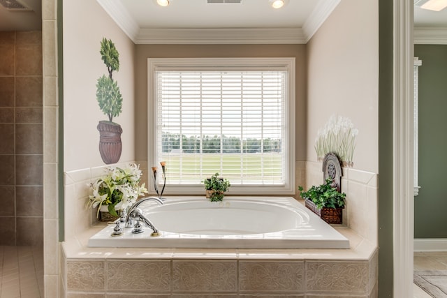 bathroom featuring ornamental molding, tiled bath, and tile patterned floors