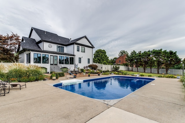 view of swimming pool with a patio