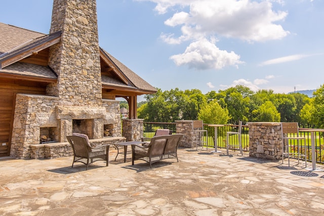 view of patio / terrace featuring an outdoor living space with a fireplace