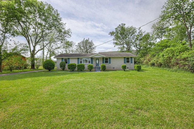 ranch-style home with crawl space, brick siding, and a front yard