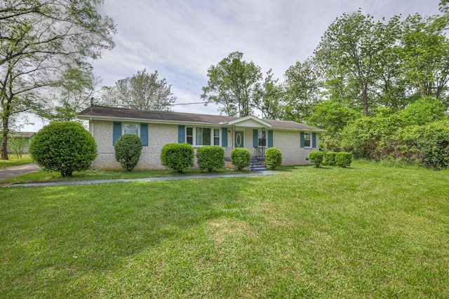 single story home with brick siding and a front lawn