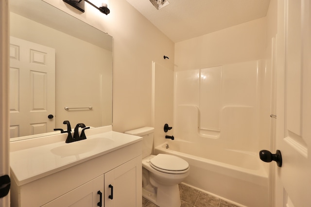 full bathroom with vanity, tile patterned floors, shower / bathing tub combination, toilet, and a textured ceiling