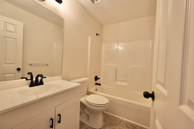 full bathroom featuring tile patterned flooring, a textured ceiling, toilet, vanity, and  shower combination