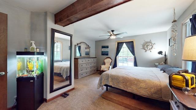 carpeted bedroom with beam ceiling and ceiling fan