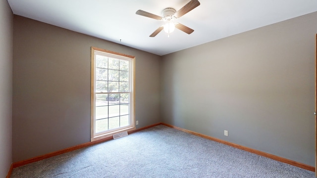 carpeted empty room with ceiling fan