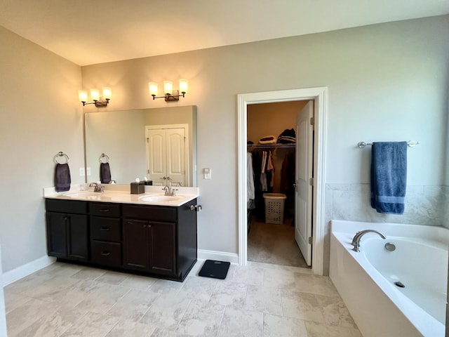 bathroom with vanity and a washtub