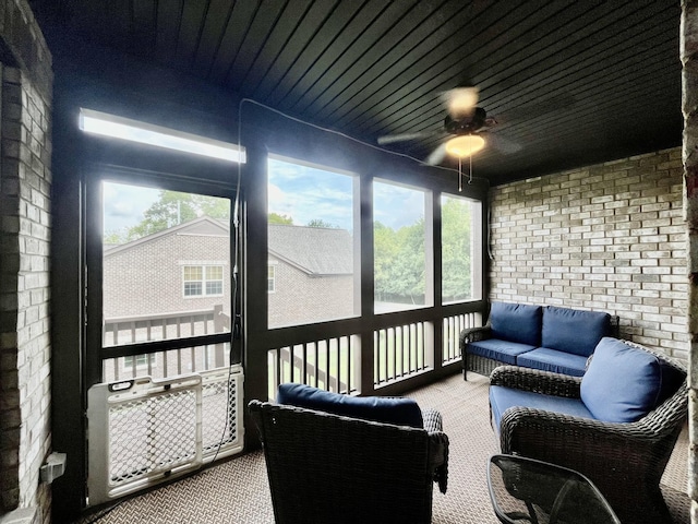 sunroom featuring plenty of natural light and ceiling fan