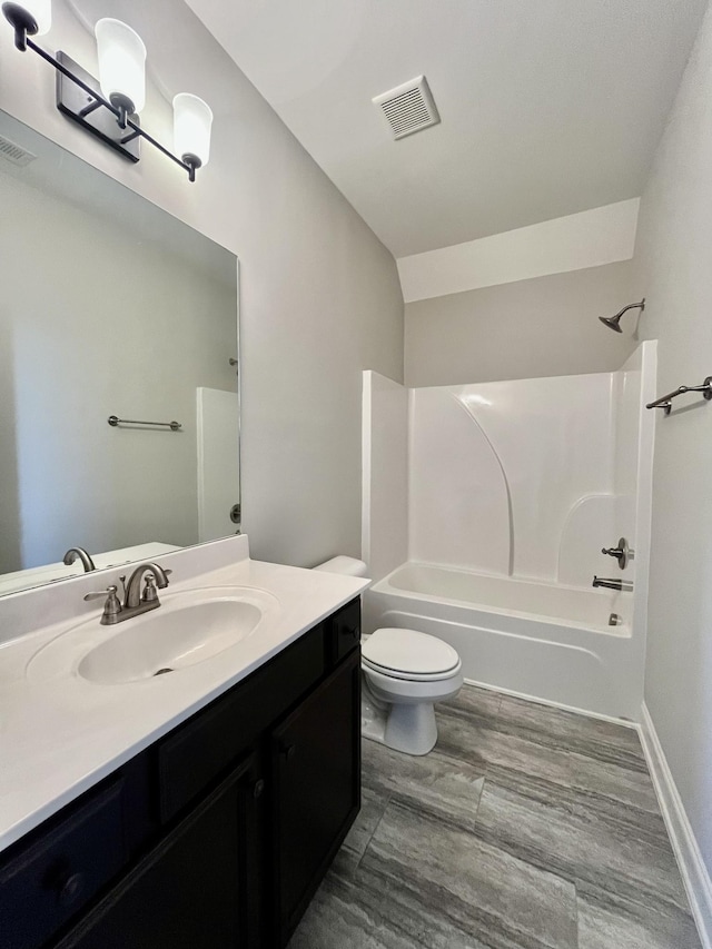 full bathroom featuring vanity, toilet, and shower / tub combination