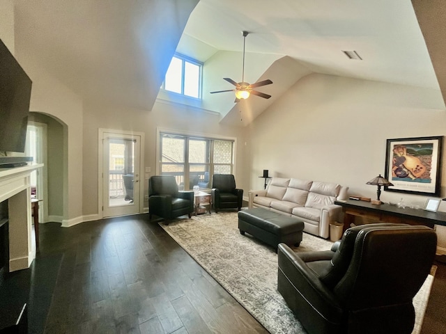 living room featuring high vaulted ceiling, dark hardwood / wood-style floors, and ceiling fan