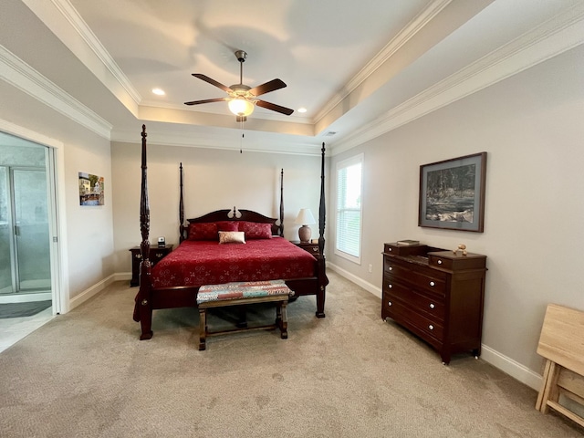 carpeted bedroom featuring crown molding, ceiling fan, and a raised ceiling