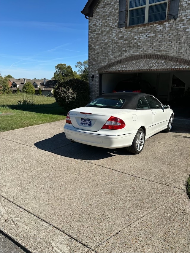 view of parking with a garage