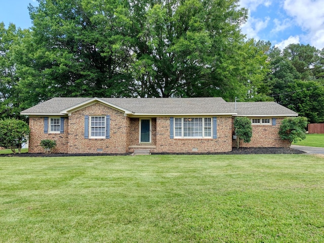 ranch-style home with a front yard