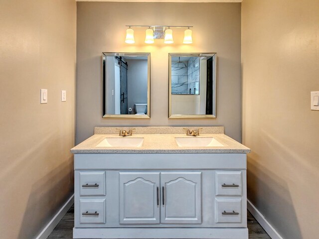 bathroom with vanity and hardwood / wood-style floors