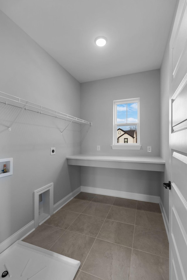 laundry room with laundry area, hookup for a washing machine, baseboards, and electric dryer hookup