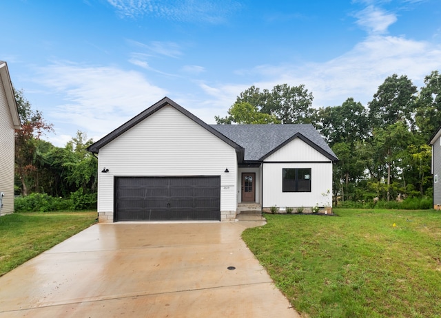 modern inspired farmhouse with a garage and a front lawn