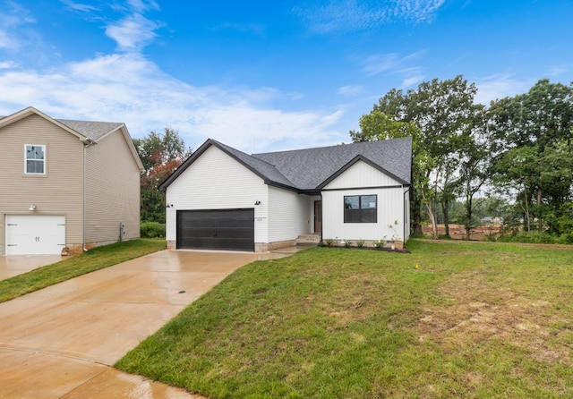 modern farmhouse style home featuring a garage and a front yard