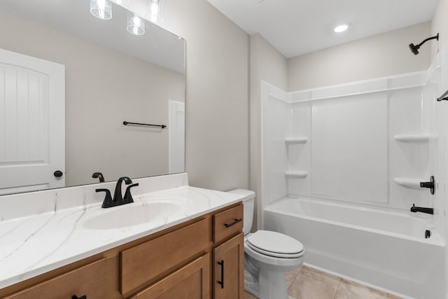 full bathroom featuring shower / bathing tub combination, tile patterned floors, toilet, and vanity