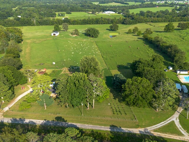 birds eye view of property with a rural view