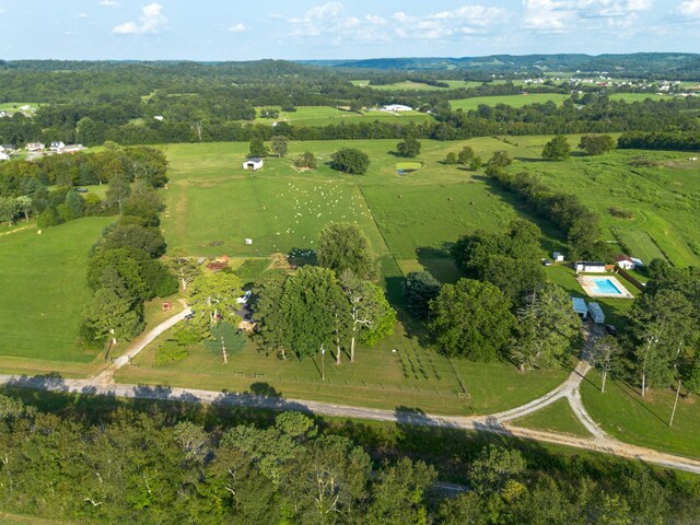 birds eye view of property with a rural view