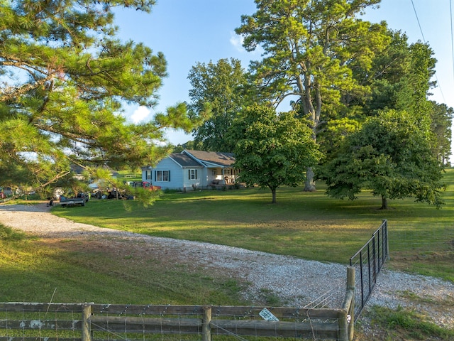 view of yard with a rural view