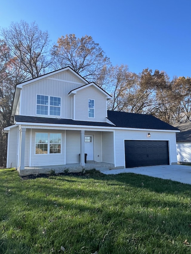 front facade with a garage and a front lawn