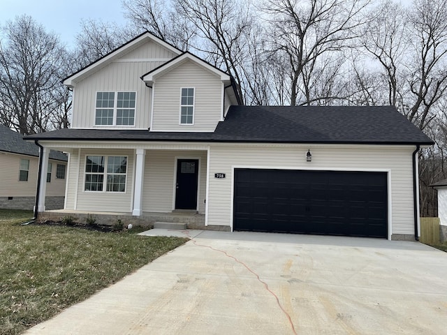 view of front of home featuring a porch, a garage, and a front lawn