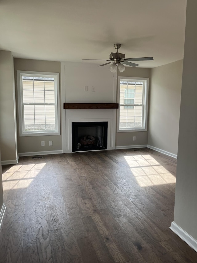 unfurnished living room with ceiling fan and light hardwood / wood-style floors