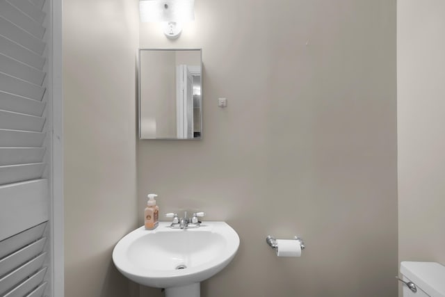 bathroom with toilet and sink