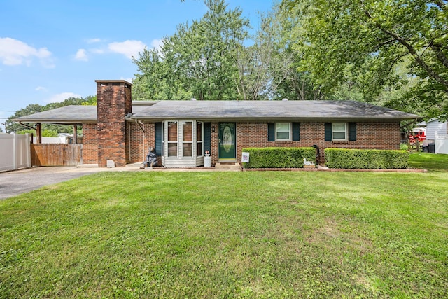 ranch-style house with a front lawn