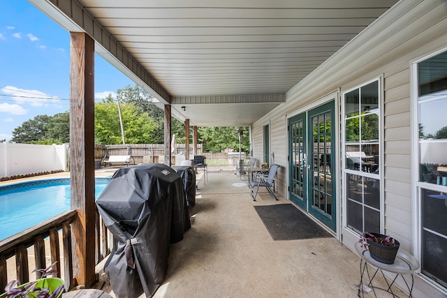 view of patio / terrace with a grill and a fenced in pool