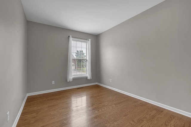 empty room featuring hardwood / wood-style floors