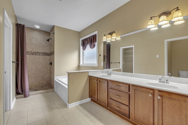 bathroom with independent shower and bath, vanity, and tile patterned floors