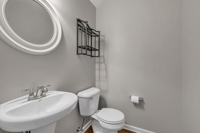 bathroom featuring toilet and sink