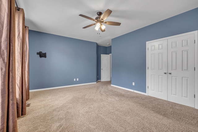 unfurnished bedroom featuring a closet, ceiling fan, and carpet