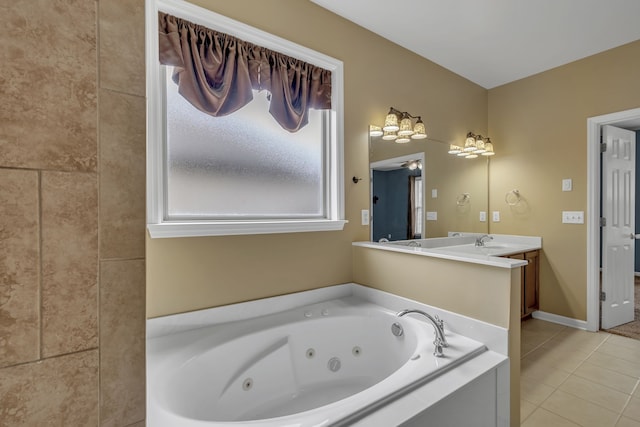 bathroom featuring vanity, a tub to relax in, and tile patterned floors